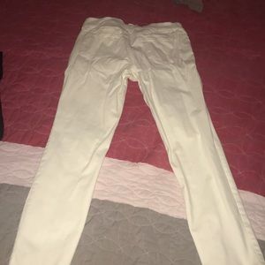 Cream stretchy jeans.